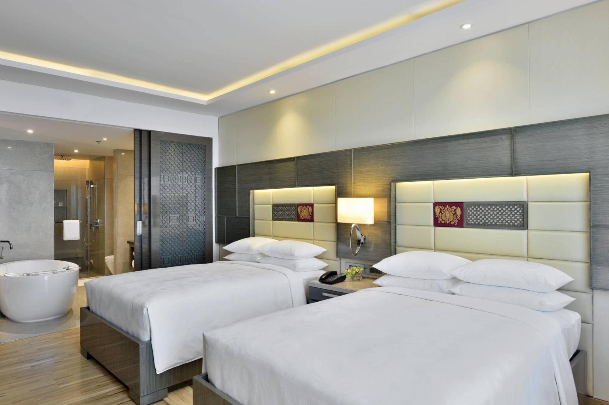 Guest Room Executive lounge access 2 Double Pool View & complimentary one-way airport transfer BOM T1 & T2
