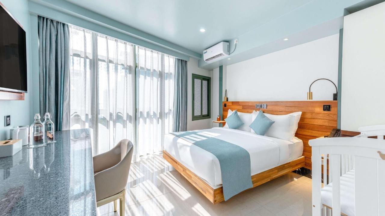Two-Bedroom Suite Partial Sea View Return Airport Transport