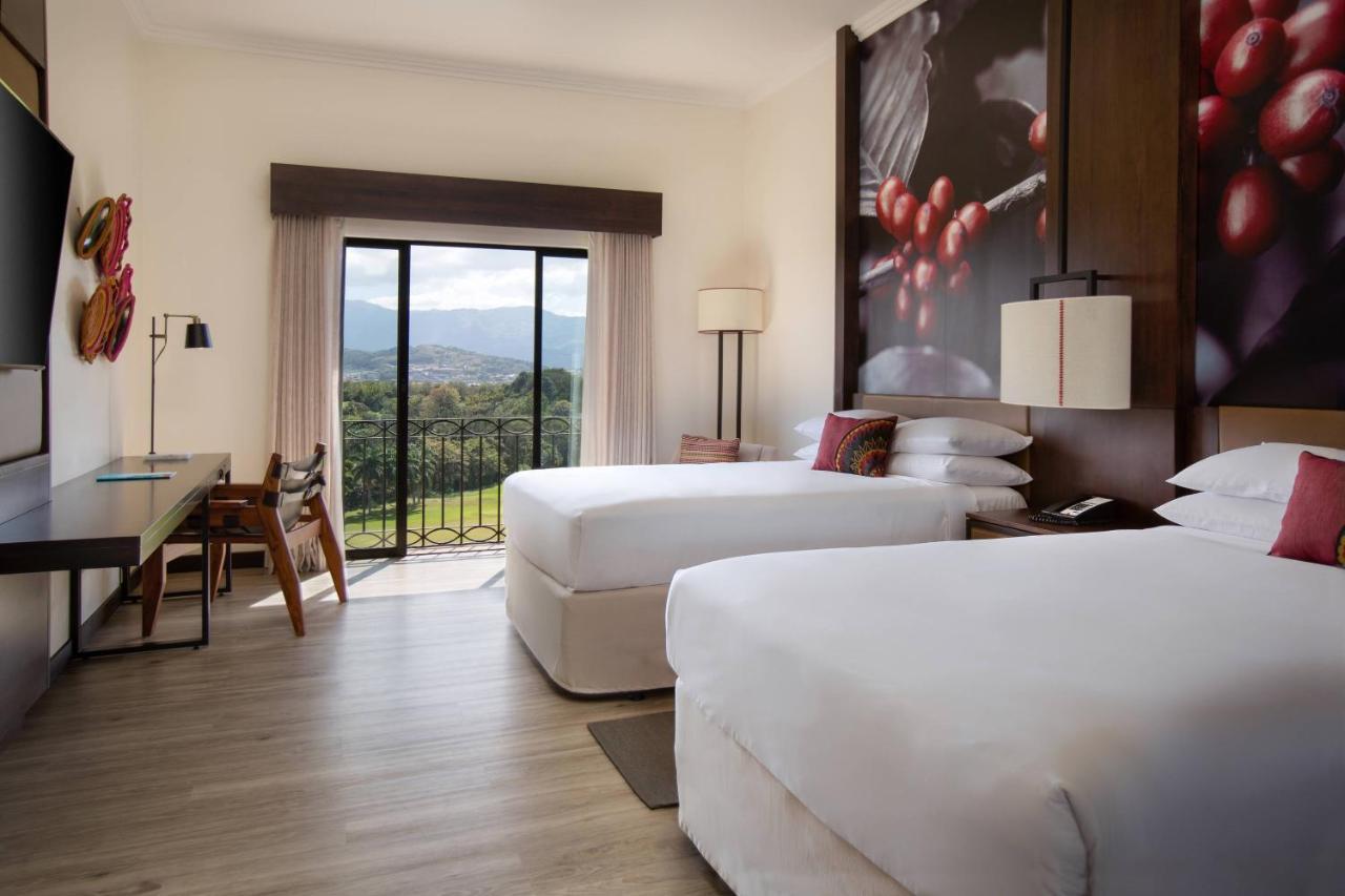 Guest Room with Two Double Beds and Mountain View