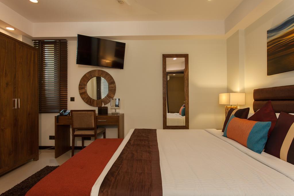 Deluxe Double or Twin Room Return Airport Transfer on Food & Beverage Complimentary Gym Access