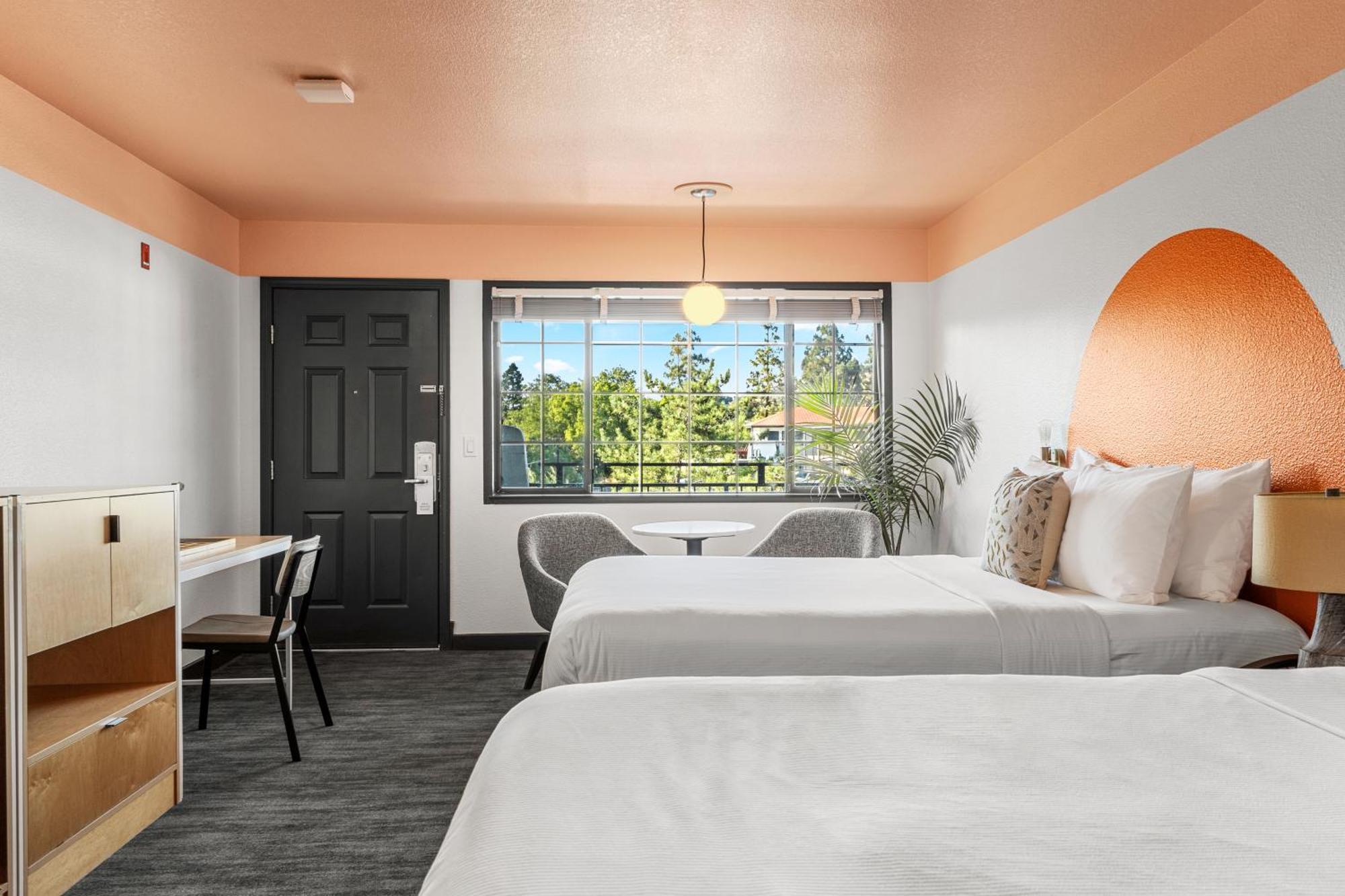 Efficiency Quadruple Room with Two Queen Beds - Non Smoking