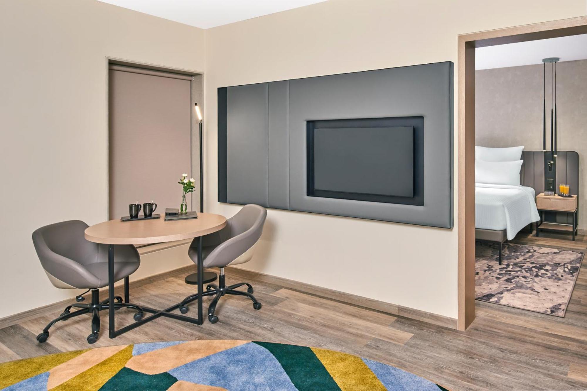 Superior Suite King Bed Living room Cocktail Hours & Short Eats