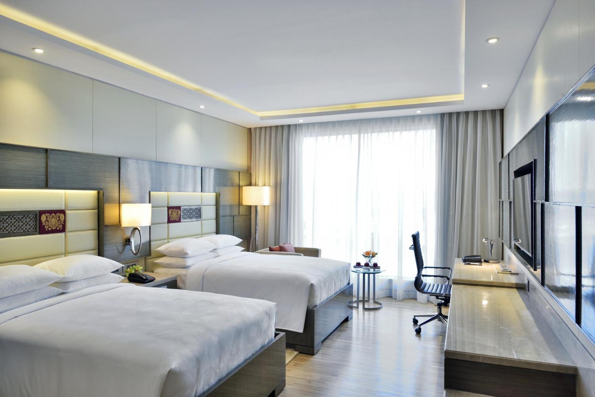 Guest Room Executive lounge access 2 Double Pool View & complimentary one-way airport transfer BOM T1 & T2