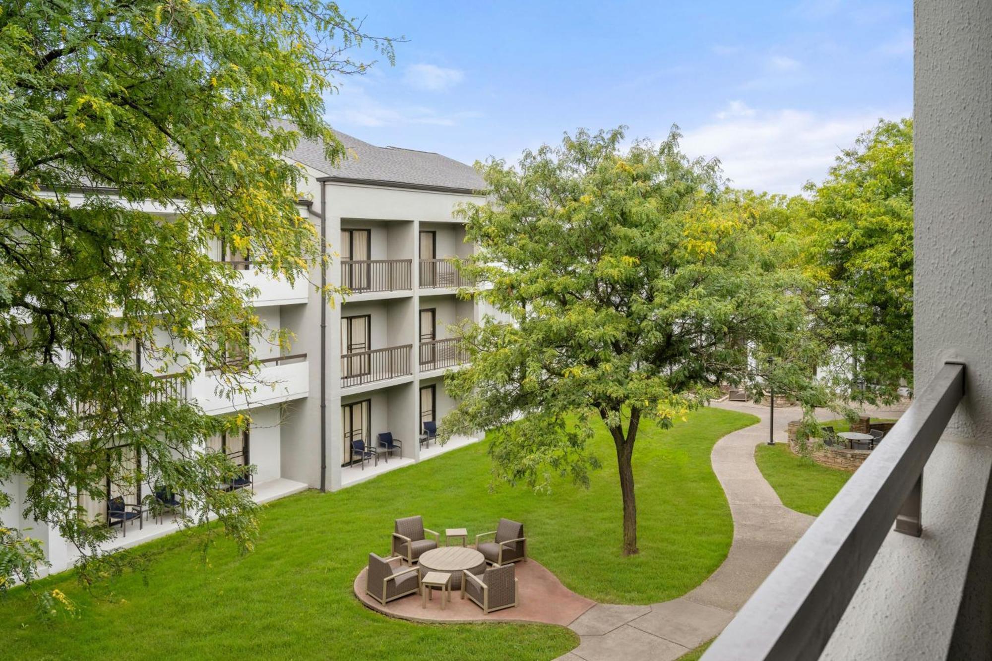 One-Bedroom King Suite Sofa Bed Adapted Tub Courtyard View Mobility Hearing Accessible