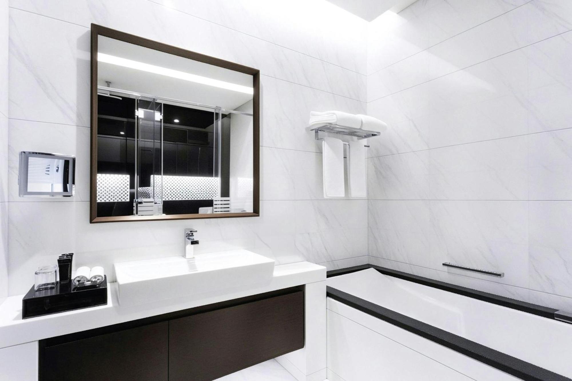 One-Bedroom King Suite Canal Bay View Lounge Access complimentary Daily Snacks Evening Cocktail Hour & Canapes Complimentary Shuttle to Dubai Mall Bay Metro Station & Kite Beach
