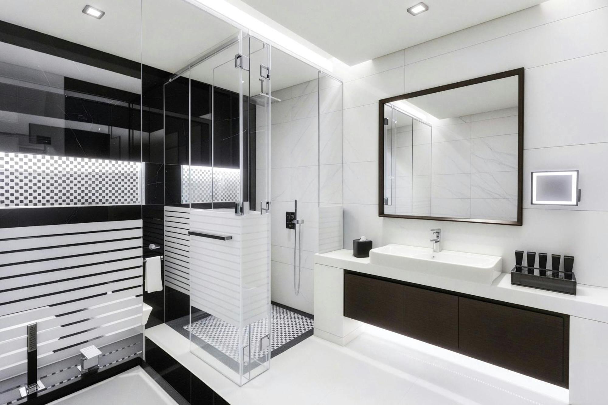 One-Bedroom King Suite Canal Bay View Lounge Access complimentary Daily Snacks Evening Cocktail Hour & Canapes Complimentary Shuttle to Dubai Mall Bay Metro Station & Kite Beach