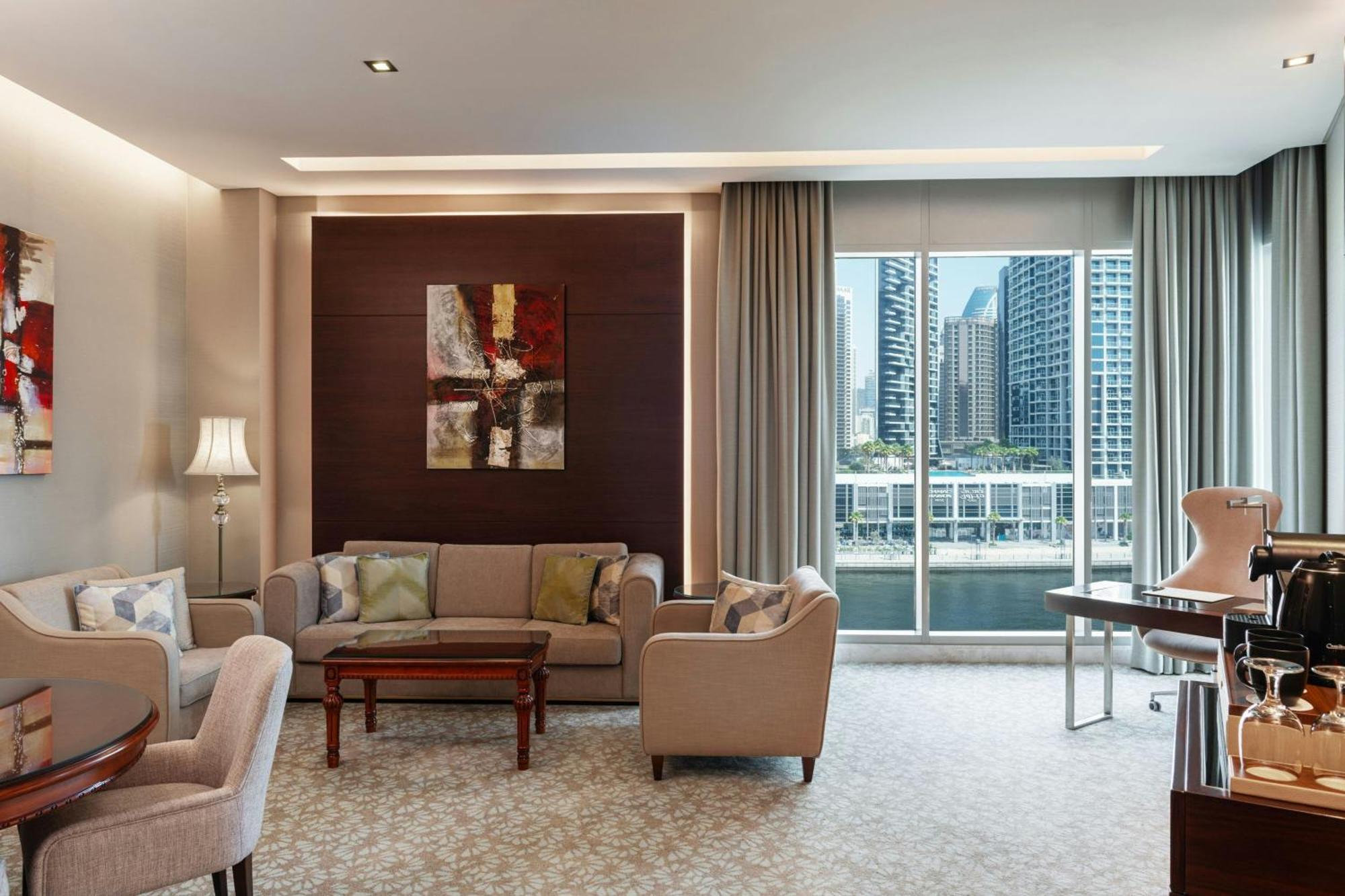 One-Bedroom King Suite Canal Bay View Lounge Access complimentary Daily Snacks Evening Cocktail Hour & Canapes Complimentary Shuttle to Dubai Mall Bay Metro Station & Kite Beach