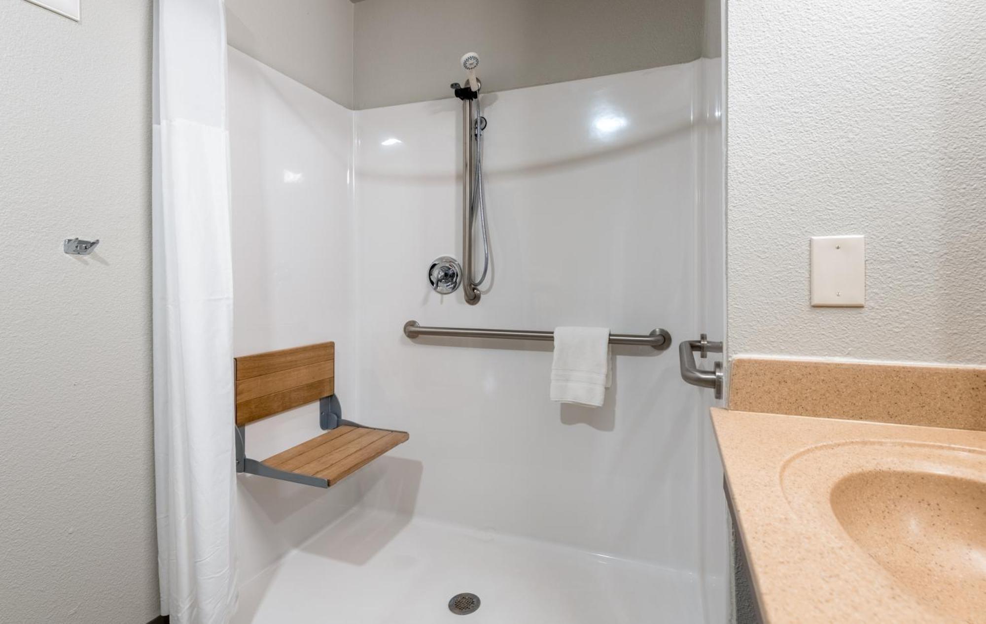 Queen Room Hearing & Mobility Accessible Roll Shower