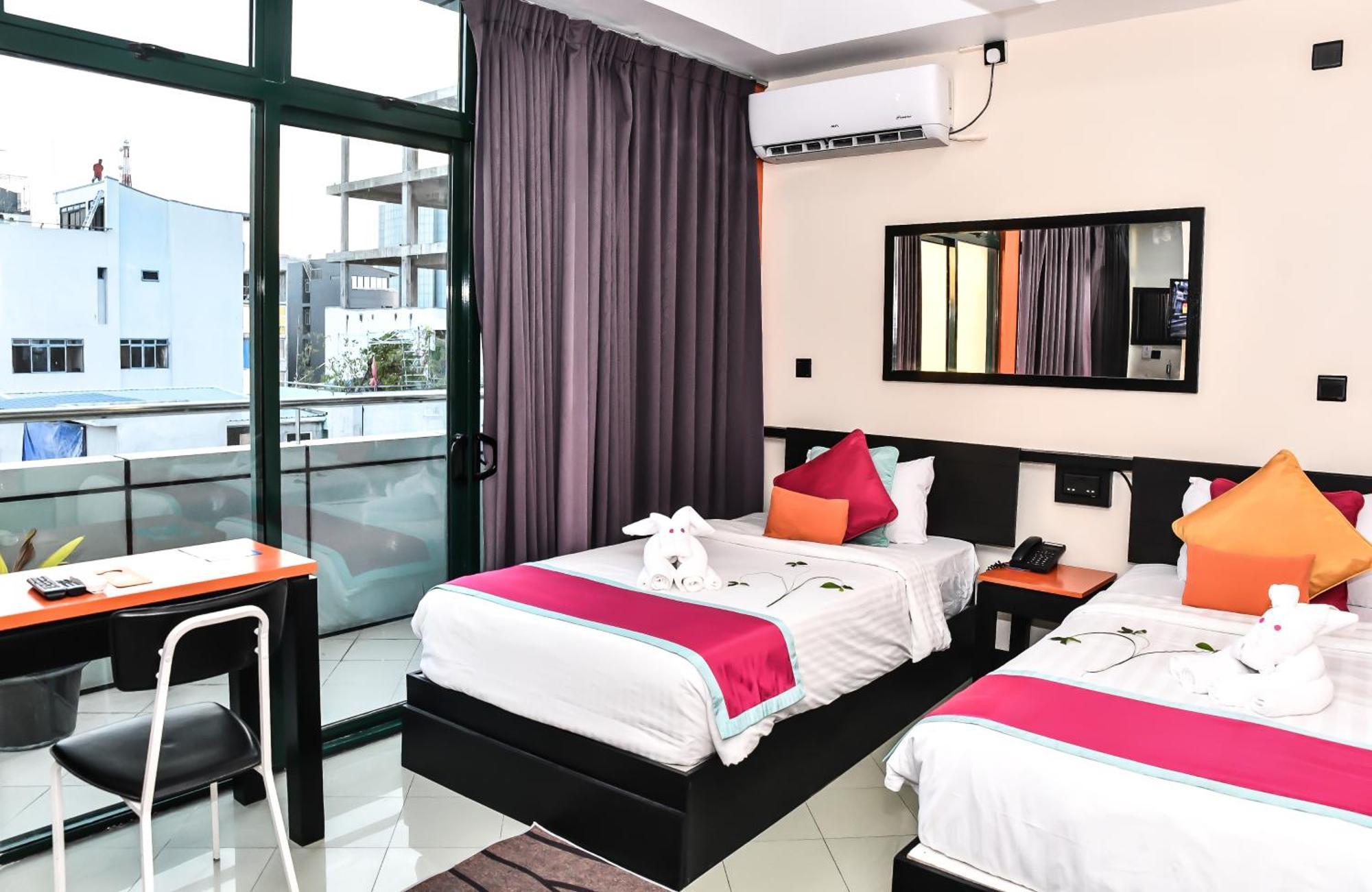 Deluxe Double or Twin Room Return Airport Transfer on Food & Beverage