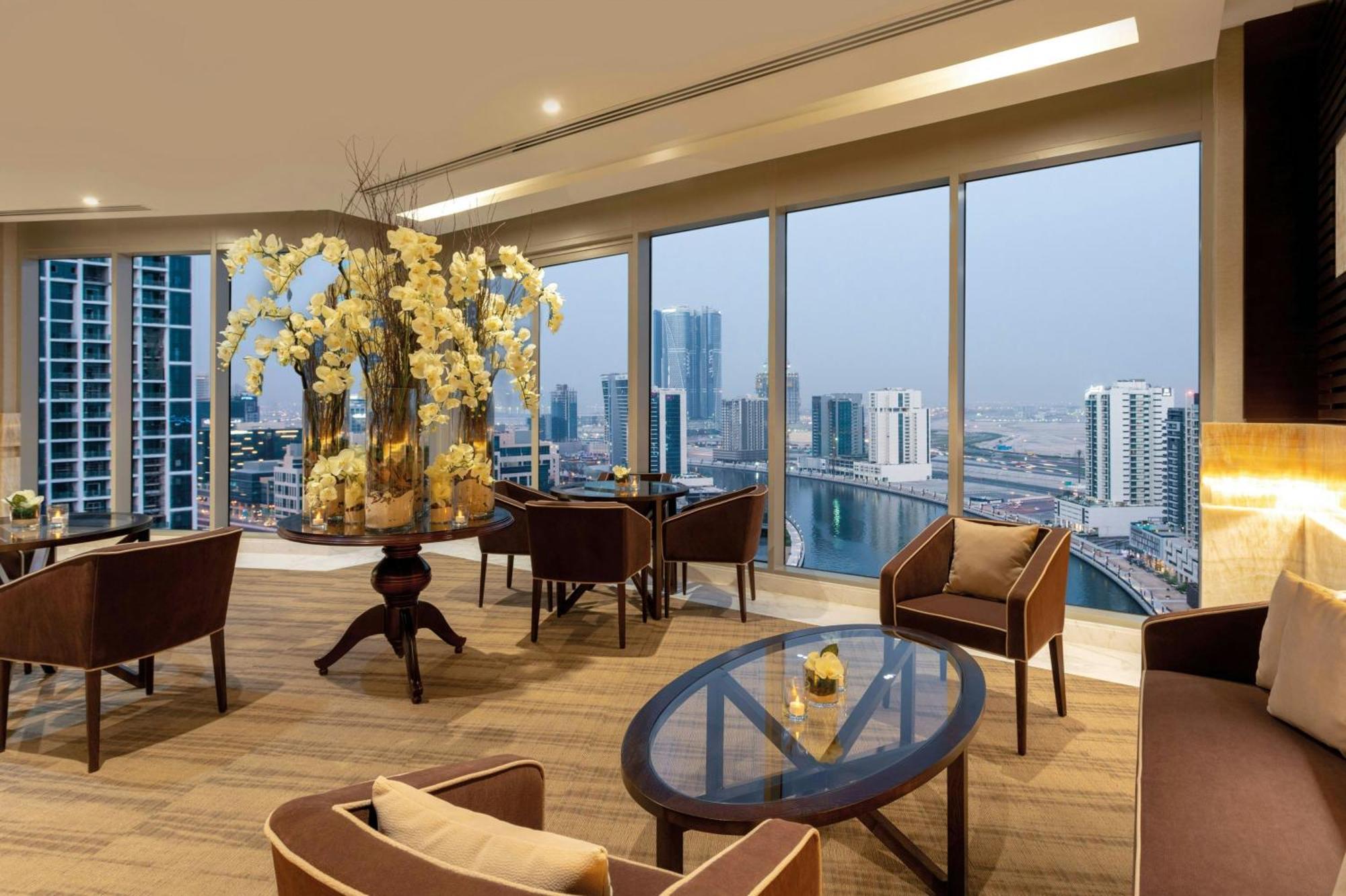 One-Bedroom King Suite Canal Bay View Lounge Access complimentary Daily Snacks Evening Cocktail Hour & Canapes Complimentary Shuttle to Dubai Mall Bay Metro Station & Kite Beach