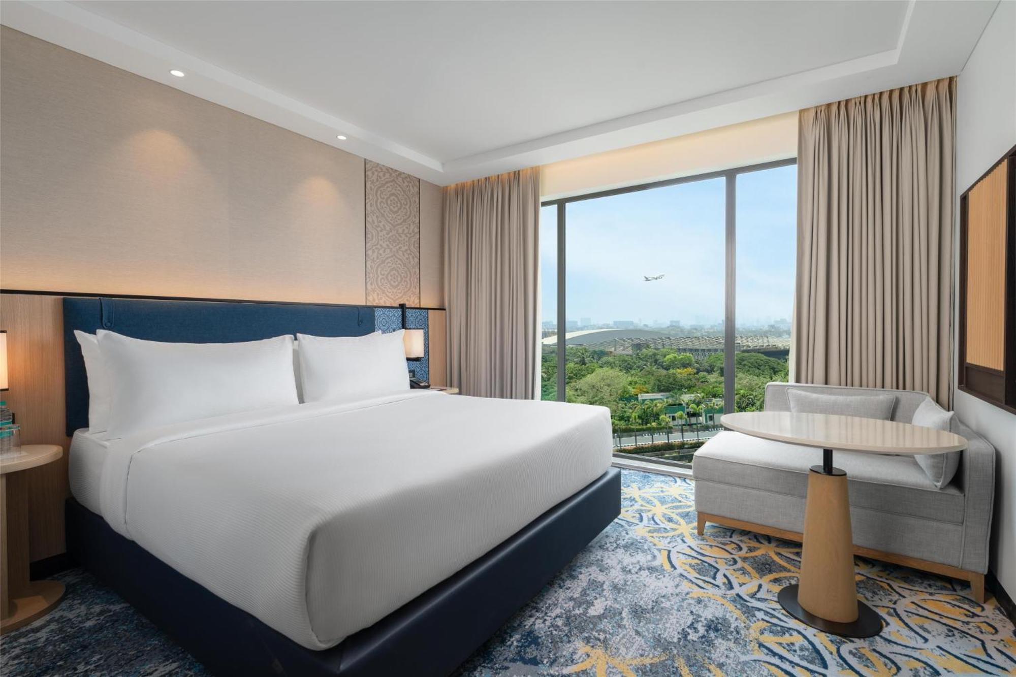King Guest Room with Runway View with 50% discount on Buffet Dining, 15% discount on laundry , 20% discount on à la carte and Happy Hours 1+1 offer on select beverages from 4pm to 8pm