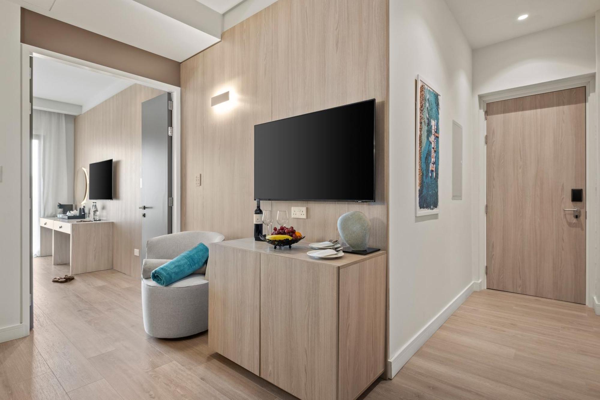 Superior room with double bed, sofa and balcony