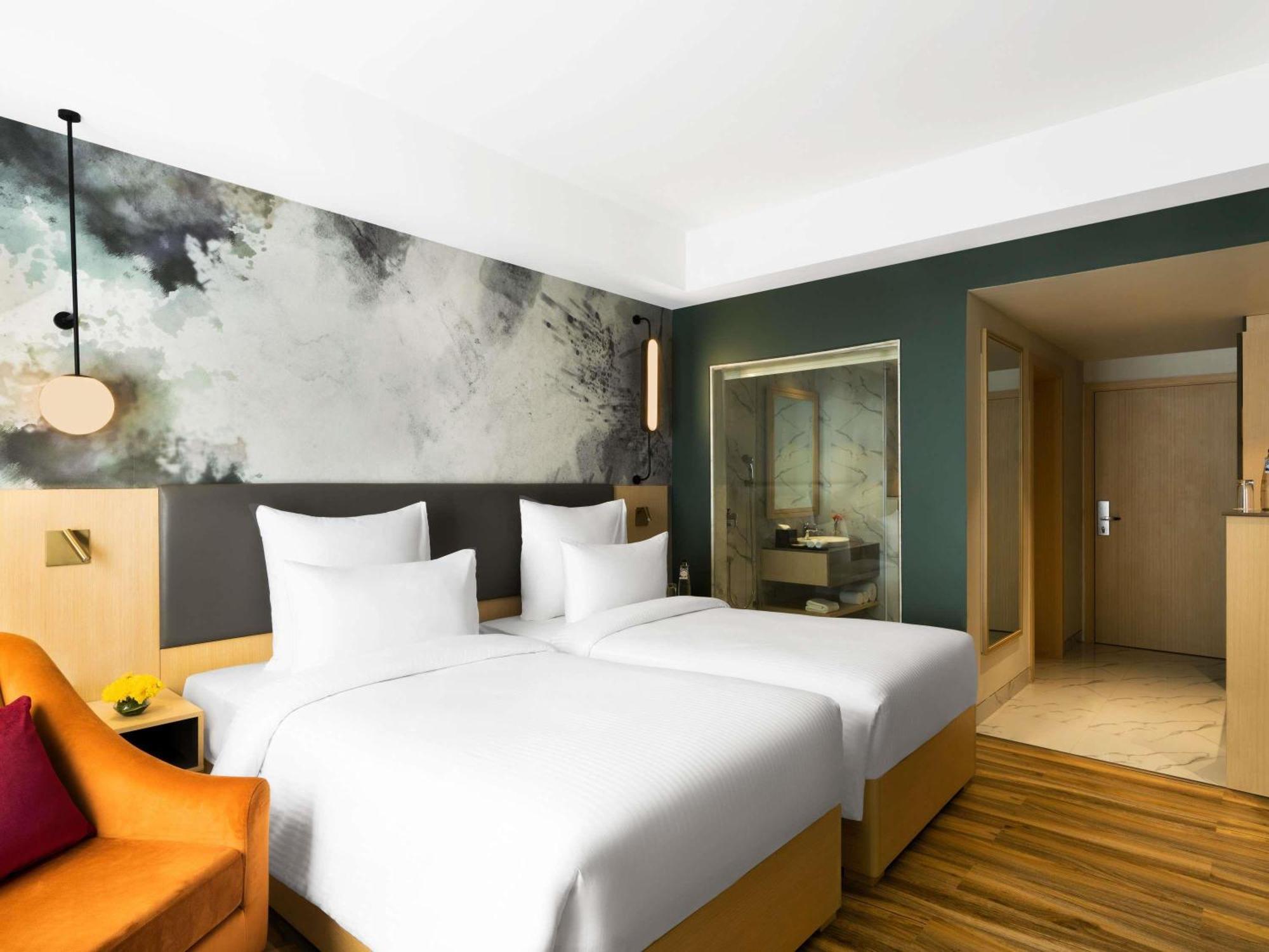 Superior Twin Room - Pool Side/Non-Smoking: : Avail 15% Off on SPA, 15% off on Food and Soft Beverages Buy 1 Get 1 on drinks (11 AM-7 PM) at GB*, Free Gaming Zone access, Complimentary Wellness Access (Steam, Sauna, Gym), Kids stay Complimentary