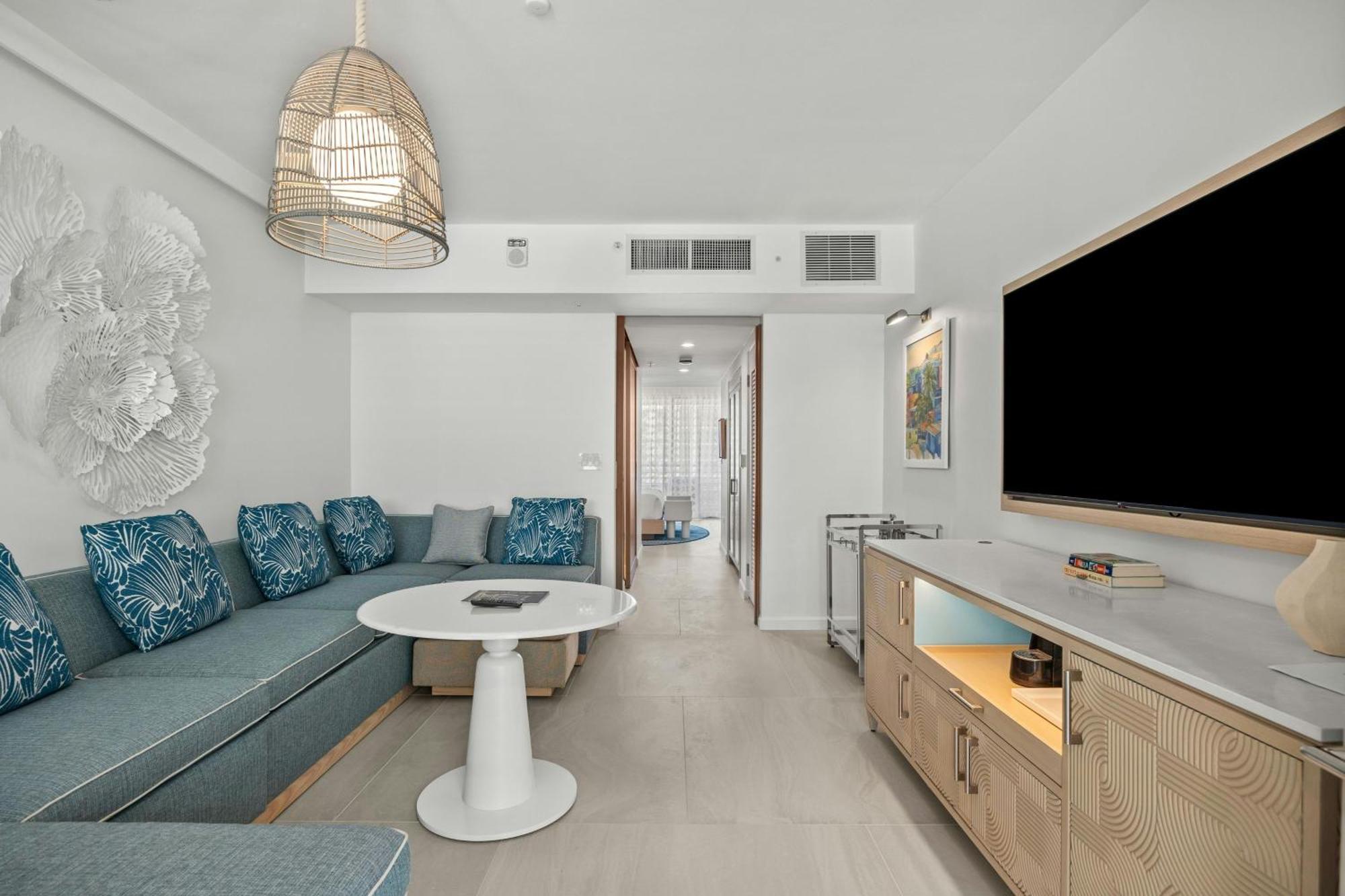 One-Bedroom Deluxe King Suite with Sofa Bed and Partial Ocean View