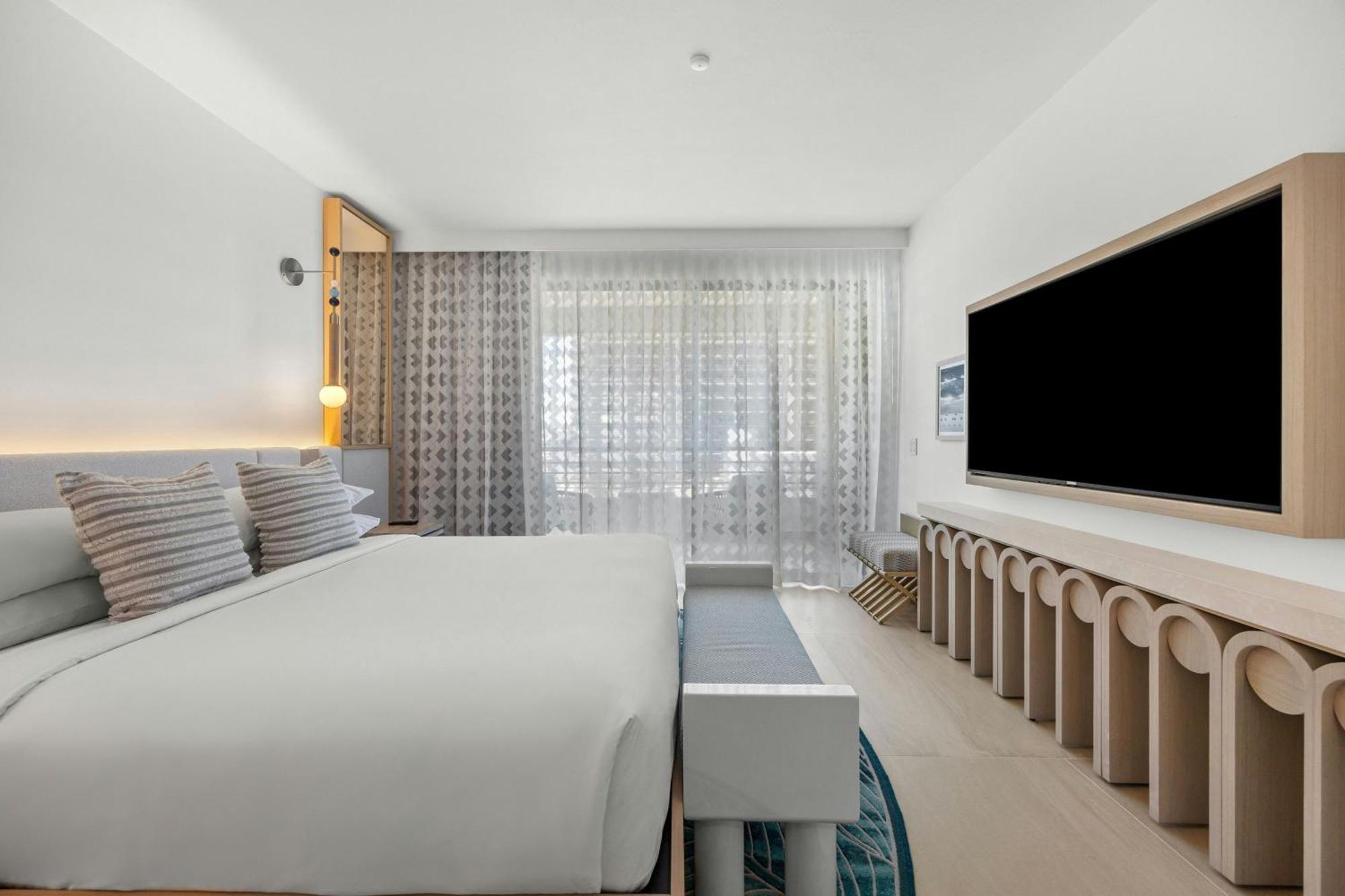 One-Bedroom Deluxe King Suite Sofa Bed Partial Ocean View