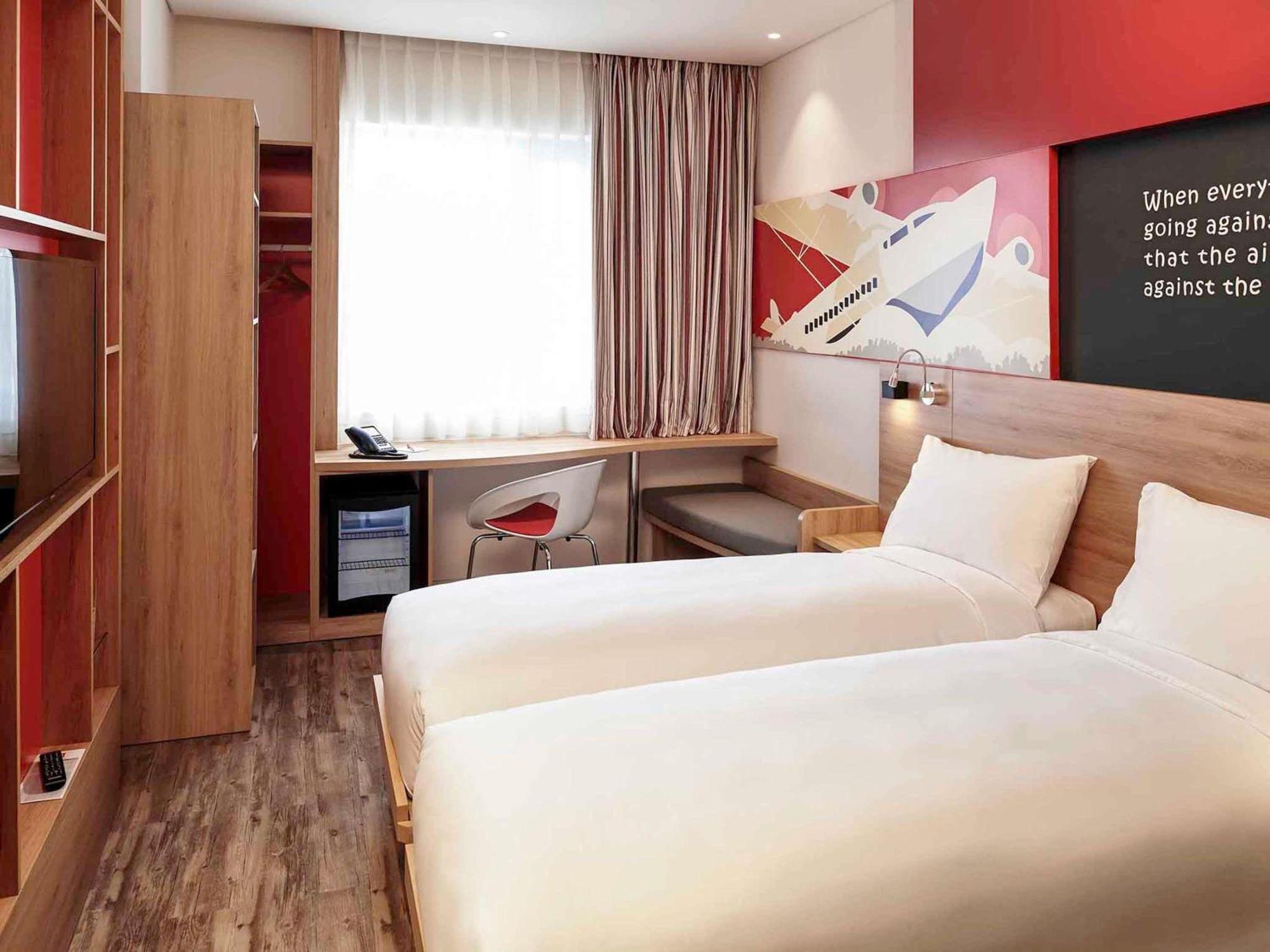 Standard Twin Room Complimentary Round-trip Transfer to International Terminal upon request