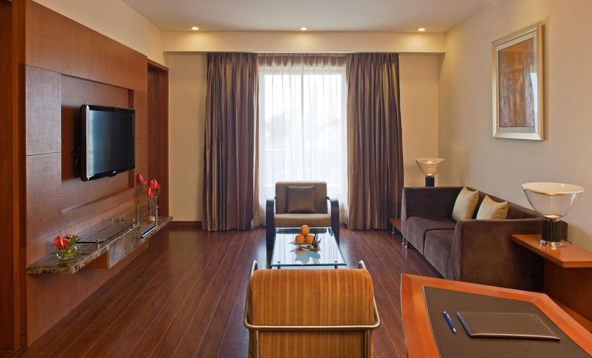 Suite 1 Bed with Happy Hours 01:00 PM to 06:00 PM 1+1 , Airport Transfers,Free Pick up and drop to Worldmark Aerocity (subject to car availability)